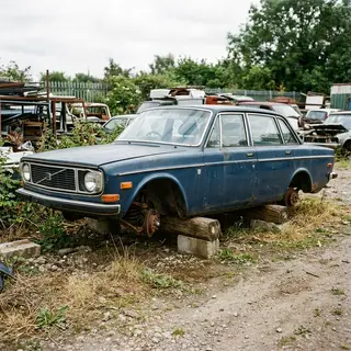 A car body with windows, doors, and headlights but no wheels