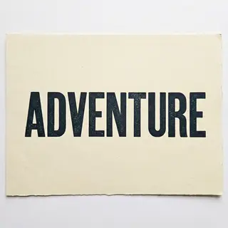 The word 'ADVENTURE' in big bold letters centered on a plain