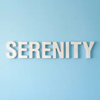 The word 'SERENITY' written large and centered on a solid li