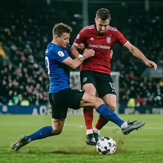 Two soccer players mid-tackle, one sliding and the other jum