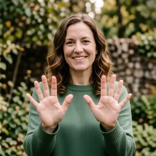 A woman holding her hands out in front of her palms-up, all 