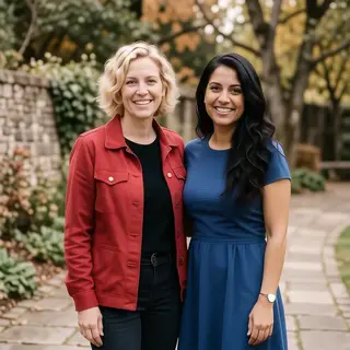Two women standing side by side: one with short blonde hair 