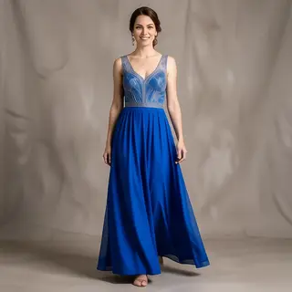 A woman wearing a royal blue evening dress against a neutral