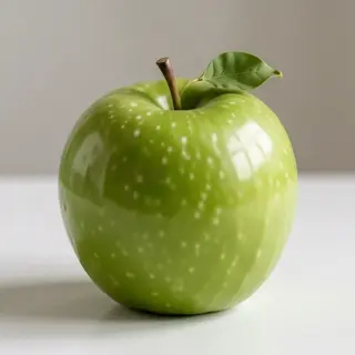 A ripe green apple on a seamless white background with soft 