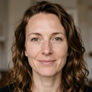 A human face with eyes, nose, and mouth but no eyebrows
