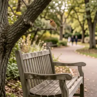 A bird perched on a branch, the branch extending from a tree
