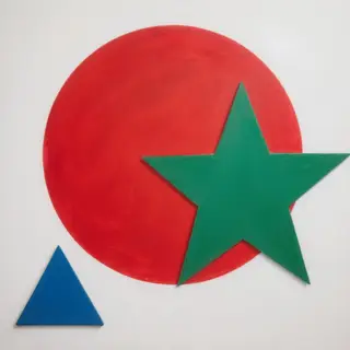 A large red circle, a small blue triangle, and a medium gree