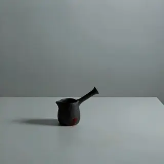 A still life painted in anxious minimalism — sparse composit