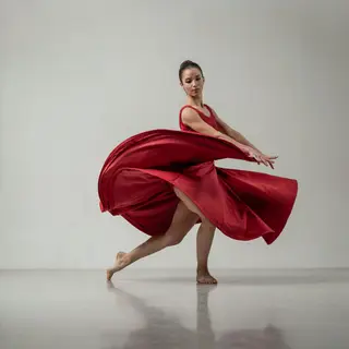 A dancer in a dynamic spin, dress flowing outward with one l