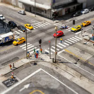 A tilt-shift photograph of a city street making real-life lo