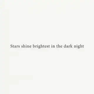 'Stars shine brightest in the dark night' displayed on a cle