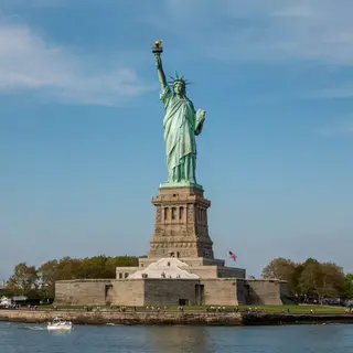The Statue of Liberty on her island pedestal, with correct t