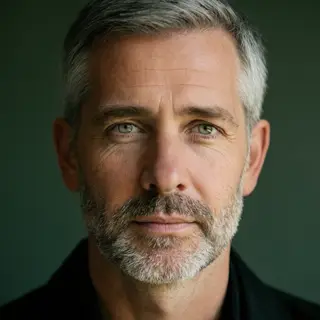 A portrait of a middle-aged man with a calm, serious express