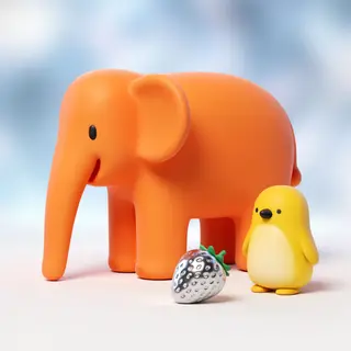 An orange elephant, a yellow penguin, and a silver strawberr