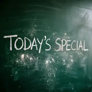 The phrase 'TODAY'S SPECIAL' written in white chalk on a dar