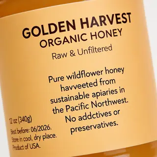 A product label for 'GOLDEN HARVEST ORGANIC HONEY' with subt