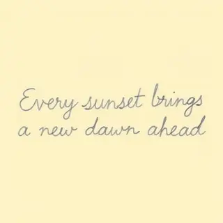'Every sunset brings a new dawn ahead' written neatly on a p