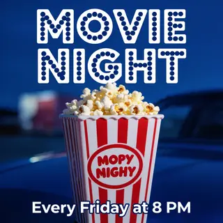 A movie night poster with a large popcorn image in the cente