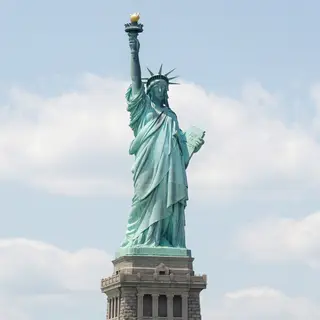 The Statue of Liberty on her island pedestal, with correct t