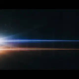 A cinematic frame with blue and orange anamorphic lens flare