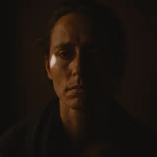 A portrait lit with classic Rembrandt lighting — triangle of