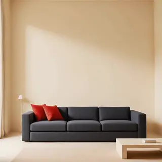 A minimalist room with walls in #F5E6CC (warm cream), a sofa
