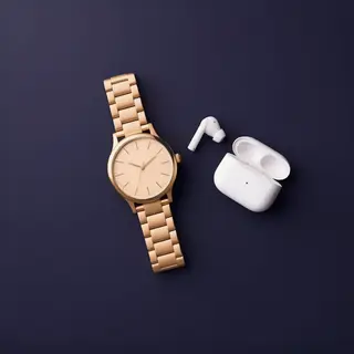 A product flat-lay on a #1A1A2E (deep dark blue) background,