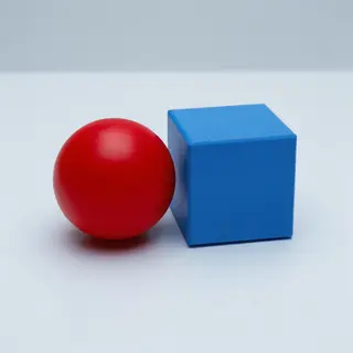 A red ball and a blue cube sitting side by side on a white s
