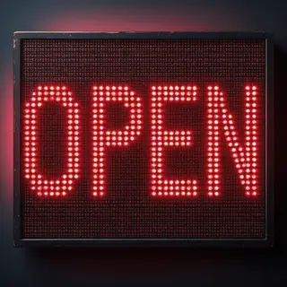 The word 'OPEN' displayed on a red LED sign with glowing pix