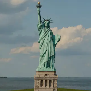 The Statue of Liberty on her island pedestal, with correct t