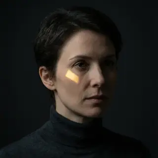 A portrait lit with classic Rembrandt lighting — triangle of