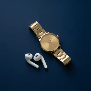 A product flat-lay on a #1A1A2E (deep dark blue) background,