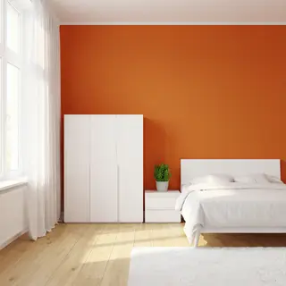 A bedroom wall painted in #FF6B35 (burnt orange) with white 