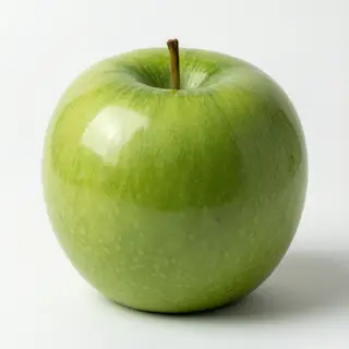 A ripe green apple on a seamless white background with soft 