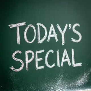 The phrase 'TODAY'S SPECIAL' written in white chalk on a dar