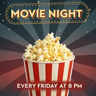 A movie night poster with a large popcorn image in the cente