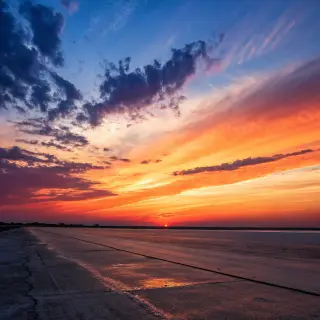 A sunset sky gradient on a flat surface from #FF6B35 (orange