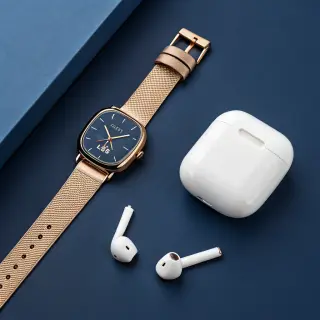 A product flat-lay on a #1A1A2E (deep dark blue) background,