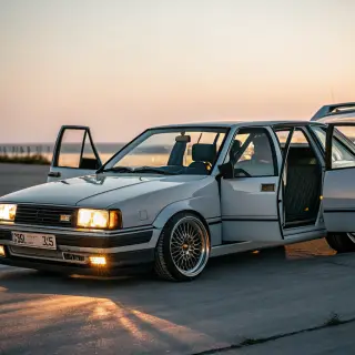 A car body with windows, doors, and headlights but no wheels