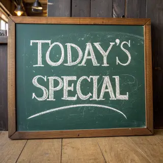 The phrase 'TODAY'S SPECIAL' written in white chalk on a dar