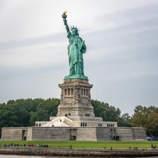 The Statue of Liberty on her island pedestal, with correct t