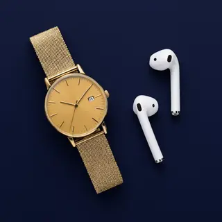 A product flat-lay on a #1A1A2E (deep dark blue) background,