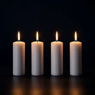 Exactly 4 white candles standing on a dark surface