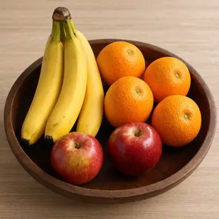 A fruit bowl containing exactly 3 bananas, 4 oranges, and 2 