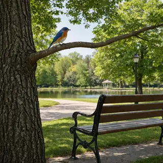 A bird perched on a branch, the branch extending from a tree