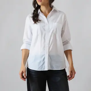 A person standing with both hands visible at their sides, fi