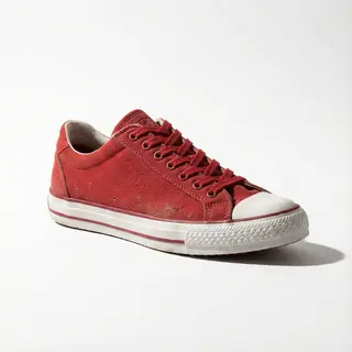 A single red sneaker on a clean white background with soft s