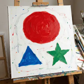 A large red circle, a small blue triangle, and a medium gree