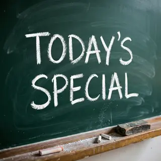 The phrase 'TODAY'S SPECIAL' written in white chalk on a dar