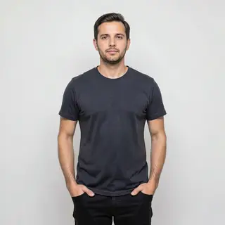 A man standing straight facing the camera, hands in pockets,